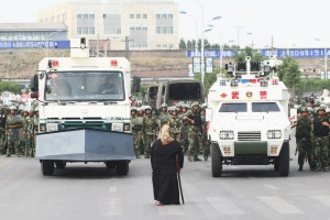 Uighur woman police trucks