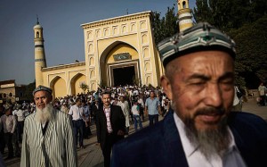 Uyghur men leave the Id Kah Mosque following Eid prayers in old Kashgar, Xinjiang  Photo: Getty